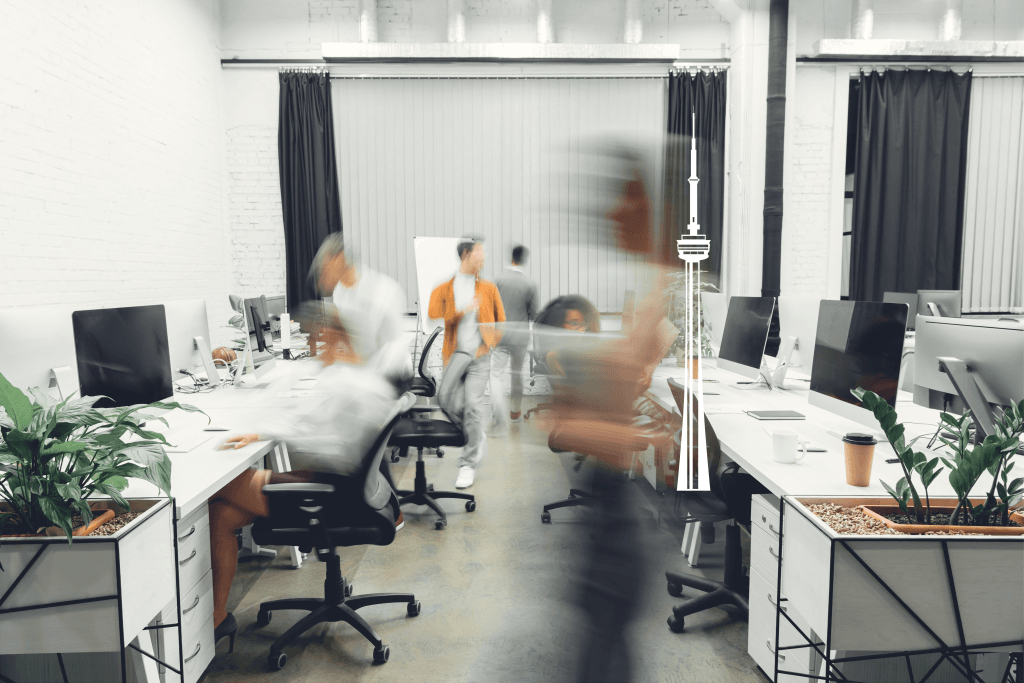 Office space, blurred with people ni motion, Toronto CN Tower