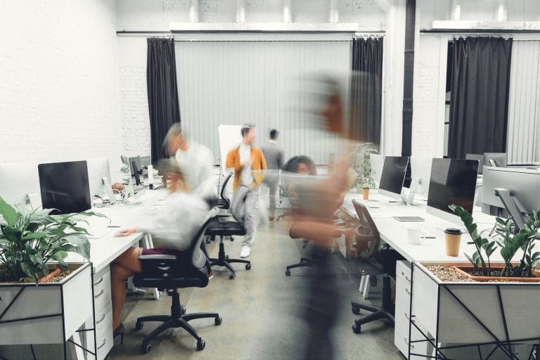 Office space, content marketing, blurred coworkers in motion